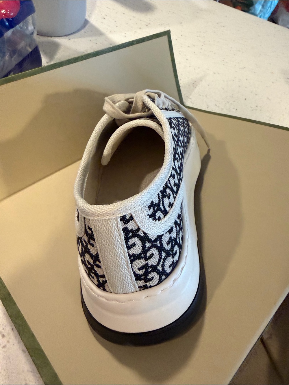 Gucci GG Canvas Low-Top Sneakers in Black & White - Picture 7 of 7